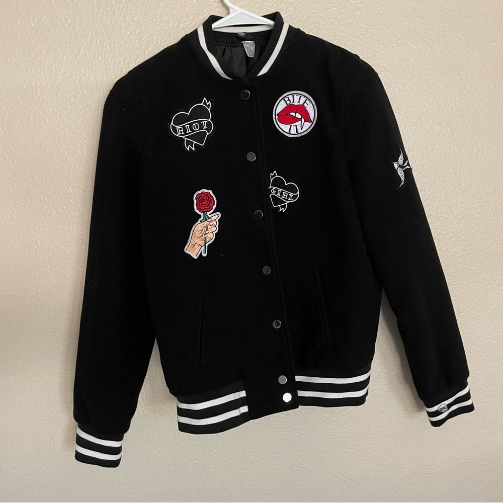Trendy Black Jacket with Unique Patches